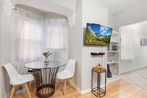 Elegant dining area with seating , perfect for enjoying meals together