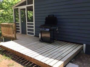 The BBQ deck and entrance to the screened in porch. 