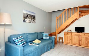 Snuggle up with a cup of coffee or tea on the comfortable sofa.