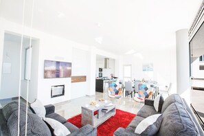 Large and modern open-plan living room, kitchen and dining area