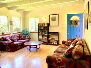 Azul cottage's bright living area with numerous windows