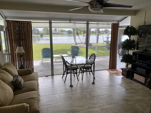 Family Room with 65" Smart TV. Dining table seats 4 comfortably.