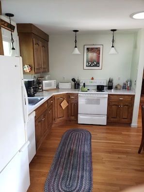 Kitchen. With living room, open space concept.