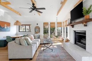 Cozy living room with large windows.