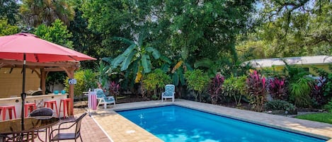 Enjoy the lush gardens at your private pool.