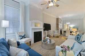 Living room to dining room, open space with lots of seating for large groups