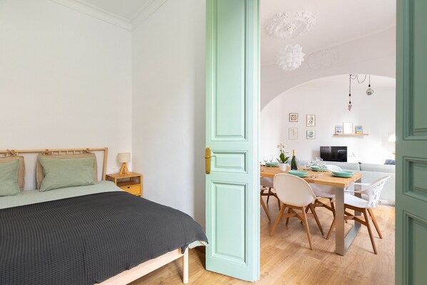 Bedroom and living room of Modernist Family Barcelona Apartment