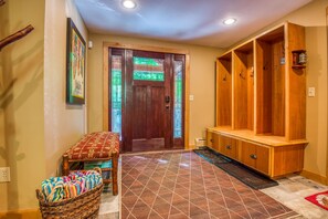 Entryway/foyer with access to attached one car garage