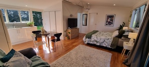 All you need in a spacious studio. Lounge, dining, kitchen, bed and bathroom.