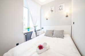 Comfortable, bright bedroom with a double bed.