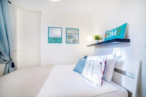 The cosy bedroom features a comfortable double bed.