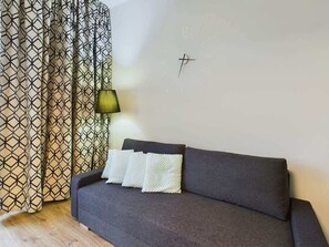 Comfortable sofa bed in the studio