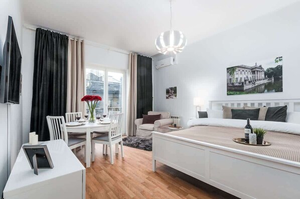 A living space consisting of a living room with a dining area.
