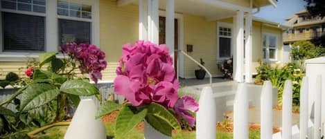 Front yard and entrance to the home is shown.