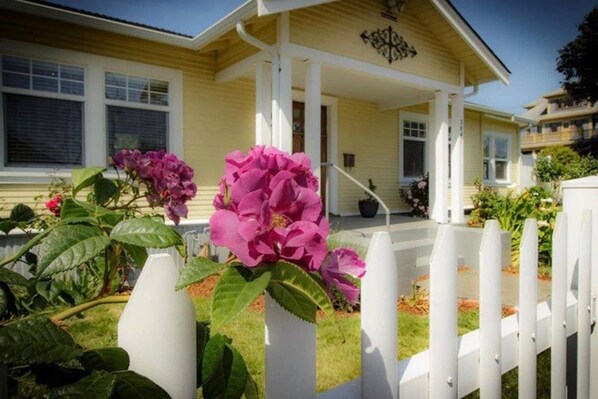 Front yard and entrance to the home is shown.