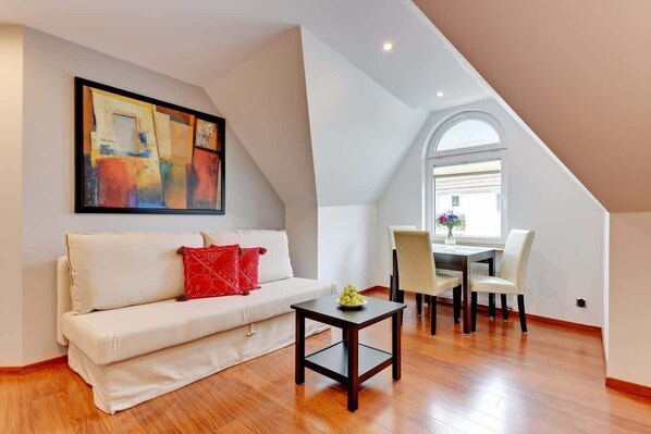 Living room with a comfortable sofa and TV. 