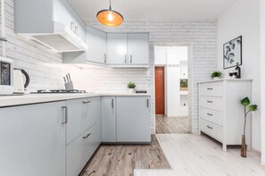 A functional and practical kitchen with bright furniture and high-quality appliances that will allow you to prepare your favourite meals.