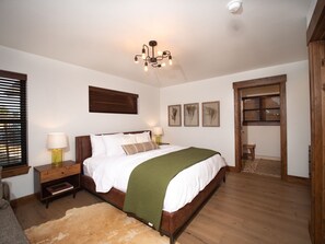 Main level master bedroom with attached private bathroom