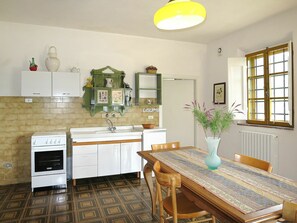 Room, Countertop, Property, Furniture, Kitchen, Cabinetry, Interior Design, Building, Yellow, Floor