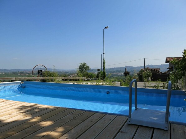 Water, Sky, Plant, Street Light, Swimming Pool, Azure, Shade, Tree, Outdoor Furniture, Rectangle