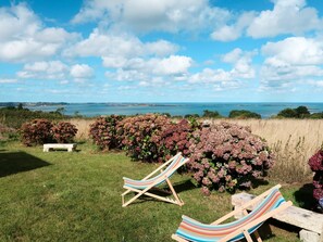 Sky, Property, Blue, Cloud, Grass, Vacation, Sea, Furniture, Ocean, House