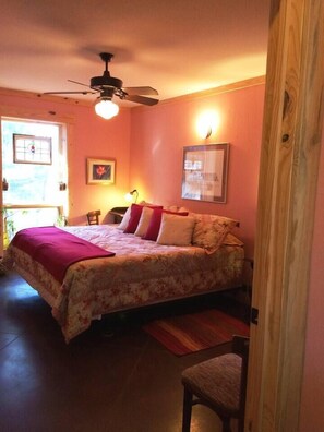 Bedroom 2 with two beds, handmade Potter Brown sink, access ADA bath, original, antique chair & writing desk. Watch for deer out window.