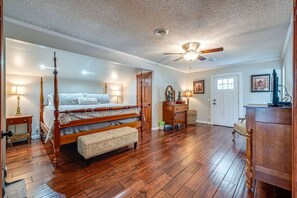 Sink into the king-sized bed with soft sheets and comfy pillows. The walk-in closet holds a hangers, pack 'n play, cleaning supplies, luggage rack, ironing board/iron and a first aid kit. Convenient front porch access for bringing in supplies.
