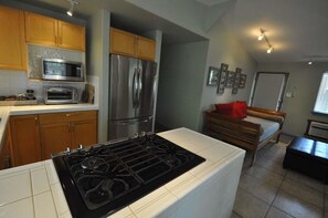 Closer view of kitchen.