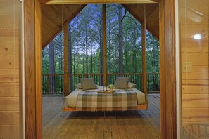Rustic Romance features an outdoor swing bed on the upstairs balcony.