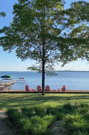 Lake access includes beach chairs and a fire pit. 600 feet from the cabin.