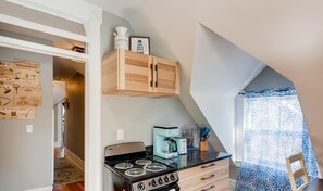 An adorable, farmhouse-styled kitchen with gas stove and all necessary supplies for your next meal.