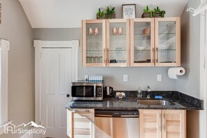 Our newly remodeled kitchen complemented with mod-rustic fixtures and is stocked with all the essentials for your stay.