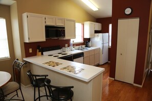 Kitchen equipped with full size Appliances.