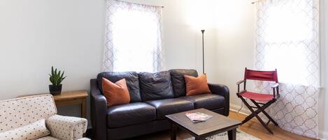 Bright and comfy Living room at the Carlisle. 