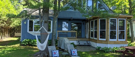 Lake view of Clearly Ours - level property with screened in Muskoka room