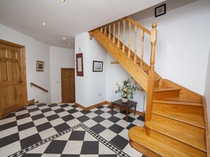 Bright entrance hall . The house is split level, 3 steps down to sitting room.