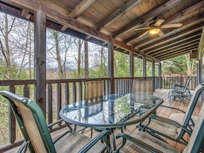 Leisurely Outdoor Living - Share dinner and drinks on the expansive covered deck surrounded by inspiring wooded hills. 
