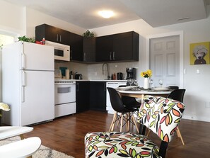 living room expansive to open kitchen for  you and family/friends' entertainment