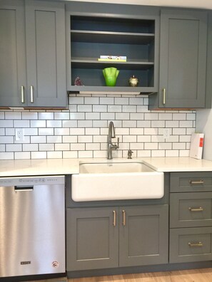 custom cabinets with Kohler cast iron farm sink
New dishwasher