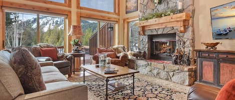 Living room with wood burning fireplace, Smart TV, DVD player