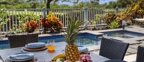 Nestled into an exclusive, gated community, this newly constructed Kailua-Kona vacation rental home boasts central air conditioning and a private pool and spa