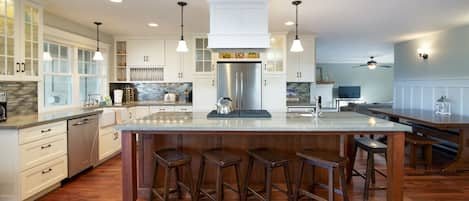 Kitchen with high end finishes and additional bar height seating