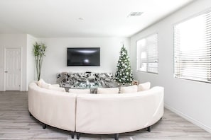 living room with 86 inch Oled Samsung TV screen