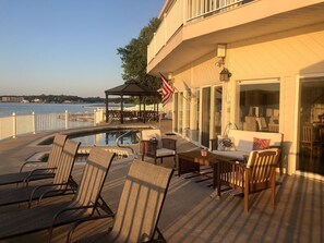 Chaise loungers, conversation set and gas grill all poolside 