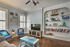 The ocean-inspired interior features built-in shelving and ocean details!