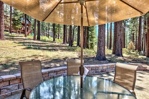 There are plenty of outdoors spaces to dine and relax beneath the shade of the pines