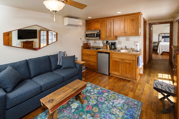 Welcome to Collings Summer House! Living area with pullout couch and dining area are perfect for up to 4 guests.  