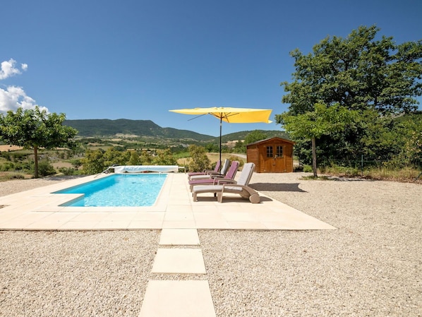 Sky, Ecoregion, Plant, Shade, Tree, Outdoor Furniture, Road Surface, Cloud, Swimming Pool, Asphalt