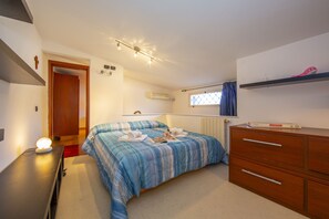 The bedroom is large and sunny