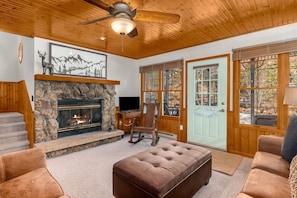 The warmth of pine accents and a wood-burning fireplace.